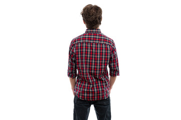 A young man standing with his back to the camera, wearing a checkered shirt against a white background.