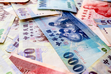 A Large Spread of New Taiwan Dollar Banknotes, Representing Wealth and Financial Concept