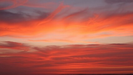 Fototapeta premium Radiant Evening Sky with Purple and Orange Clouds at Sunset