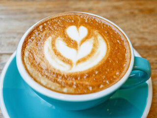 A cup of coffee latte art with steamed milk
