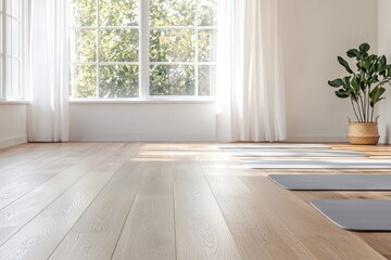 A serene yoga studio with wooden floors, natural light streaming through large windows, and a potted plant, creating a calming atmosphere for practice.