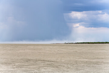 rain wall dissolving at mid air on Etosha pan, from Lookout point, Namibia