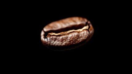 A close-up image of a single roasted coffee bean against a black background, showcasing its rich color and texture, ideal for coffee-related themes.