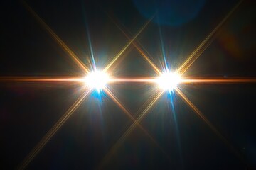 Obraz premium Two bright stars shining intensely, creating a mesmerizing light spectacle with crisscrossing rays.