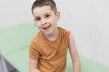 Caucasian smiling boy in clinic