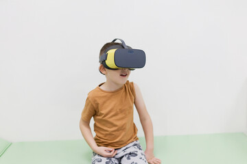 Caucasian boy in vr glasses clinic