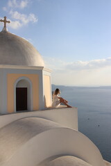 Young blonde woman in santorini greece 