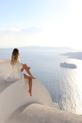 Young blonde woman in santorini greece 