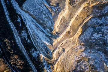 Aerial view of a open pit mine. Mountain exploided for buildings materials.