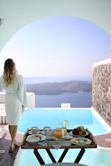 Young blonde woman in santorini greece 