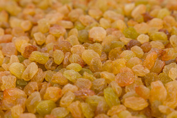 Dried raisins as background. Close up. Whole background. Selective focus.