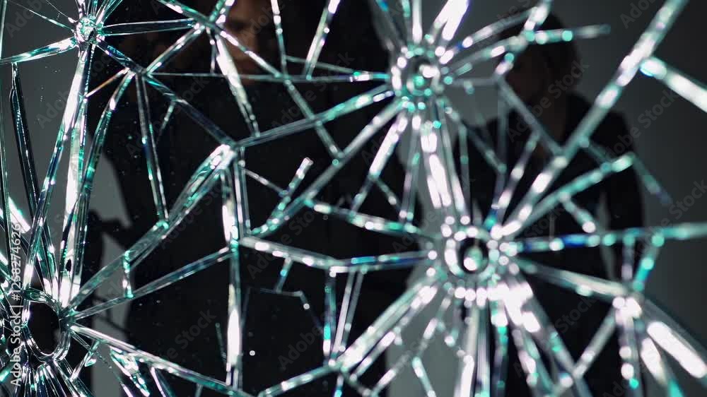 Poster intricate patterns emerge from shattered glass in an artistic display of reflections and light