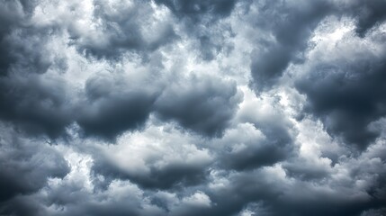 Obraz premium Dark and Dramatic Cloudy Sky with Shades of Gray and Blue