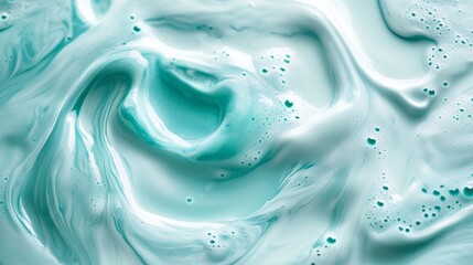 Teal melted milk swirl on white background. Sour cream or yogurt swirl texture