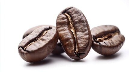 Obraz premium A pile of coffee beans isolated on a white background, emphasizing their organic shape and earthy tones.