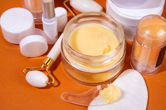 Tallow cream, serum and facial skin care products in sticks. Trendy cream based on animal fat, concept of natural moisturizing, skin restoration, healthy organic fatty acids, vitamins beauty care