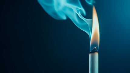 Flame of a Candle with Smoke Against a Dark Blue Background