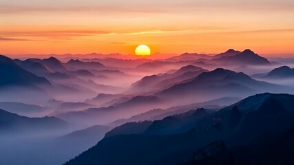 Serene Sunset Over Layered Mountains and Misty Horizon