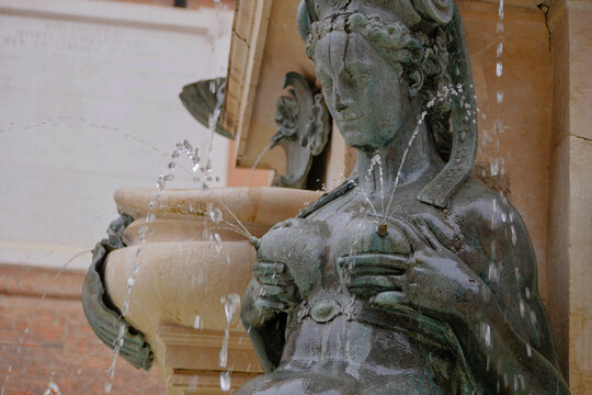 A sculpture of lactating Nereid as a part of The Fountain of Neptune in Bologna, Italy