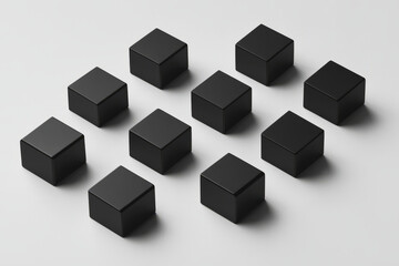 Obraz premium minimalist black cubes arranged in a symmetrical pattern, with soft shadows on a light gray surface.