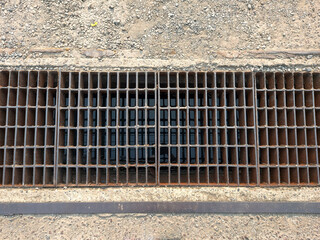 rusty iron grate of water drain
