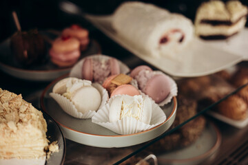 Assorted macaroons sweet pastries in store display.