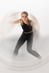 Dancer in motion showcasing dynamic movements and grace against a minimalistic background