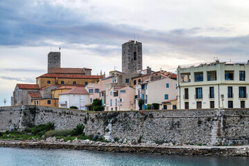Fototapeta premium Antibes castle and central square, wall and tower by the sea