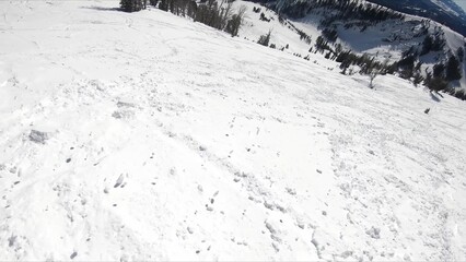 Active Holiday: Unidentified Skier Swiftly Descending Down A Snowy Mountain Slope
