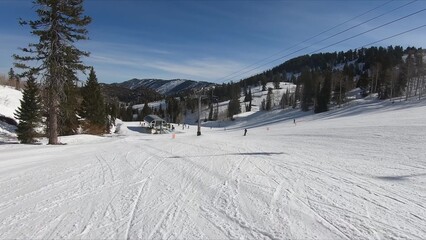 Enthusiastic Skier Making Their Way Down A Snow-covered Hill In Winter