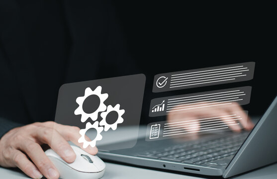Business process optimization. Robotic process automation or RPA. Engineer setting up automated software. Automated industrial technology with digital transformation.