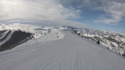 Exciting Winter Scene Of Diverse People Enjoying Skiing On A Snow-covered Ski Slope