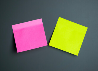 Bright sticky notes on a dark background showcase colors