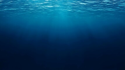 Obraz premium Underwater Sunlight Rays Through Deep Blue Ocean Water