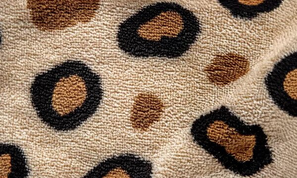 A close-up view of a stylish leopard print textile, showcasing intricate patterns that combine a natural theme with contemporary fashion elements.