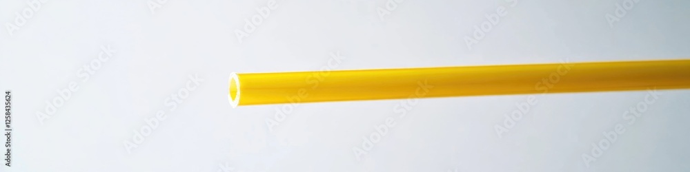 Poster a close-up shot of a small piece of yellow plastic, ideal for use in product photography or as a des