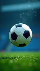 Fototapeta premium Soccer ball flying through the air with blurred blue surroundings , blur, soccer, air