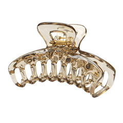 Elegant gold hair claw clip gleaming against a stark black backdrop