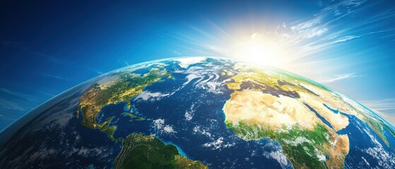 Fototapeta premium World water day. Earth from space with a bright sunrise illuminating the horizon.