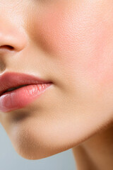 Obraz premium Close up photo with beautiful female face with plump lips. Close-up face detail.