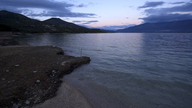 Lake Polyfyto mountain landscape view at sunset in Greece