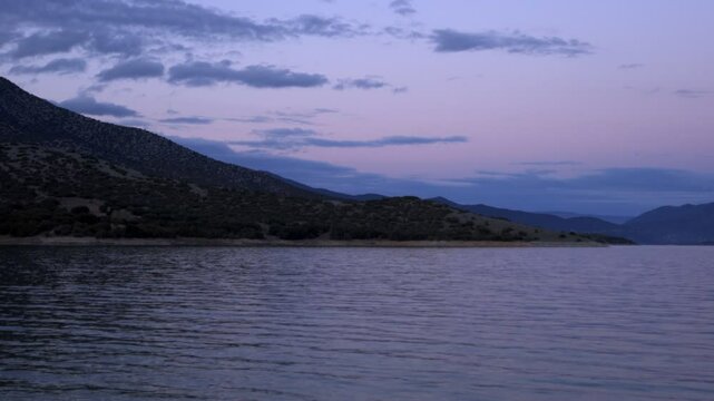 Lake Polyfyto mountain landscape view at sunset in Greece