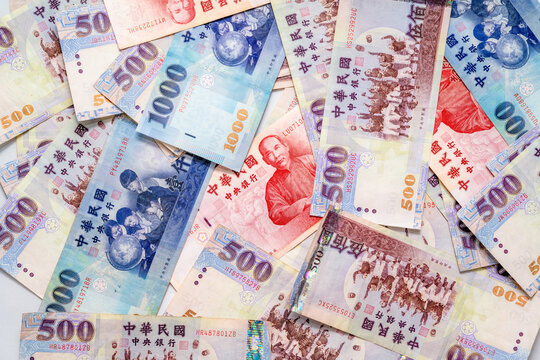 A Large Spread of New Taiwan Dollar Banknotes, Representing Wealth and Financial Concept