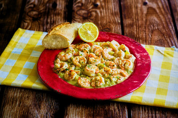 garlic shrimp served with fresh parsley and lemon
