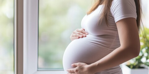 Multiple Birth Awareness Month. Expectant motherhood journey near window, natural light, maternity fashion, calming atmosphere