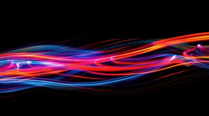 Vibrant abstract light trails in blue and red against a black background, creating a dynamic visual effect that conveys energy and movement.