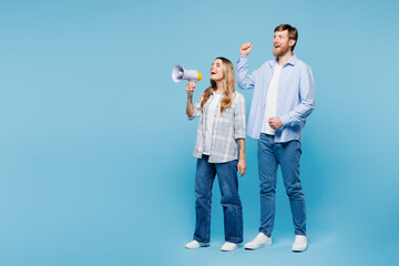 Full body young winner couple two friend family man woman wear shirt casual clothes together hold...