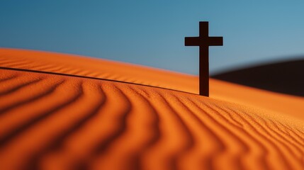 Solitary Cross Silhouette on Orange Sand Dunes Under a Clear Blue Sky Spiritual Desert Hope Icon