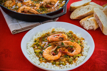 shrimp etouffe served on a bed of rice