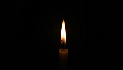 Candle flame glowing in darkness, simplicity and illumination